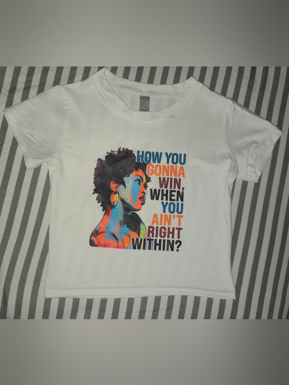 White Graphic Tee with Colorful Portrait and Motivational Text